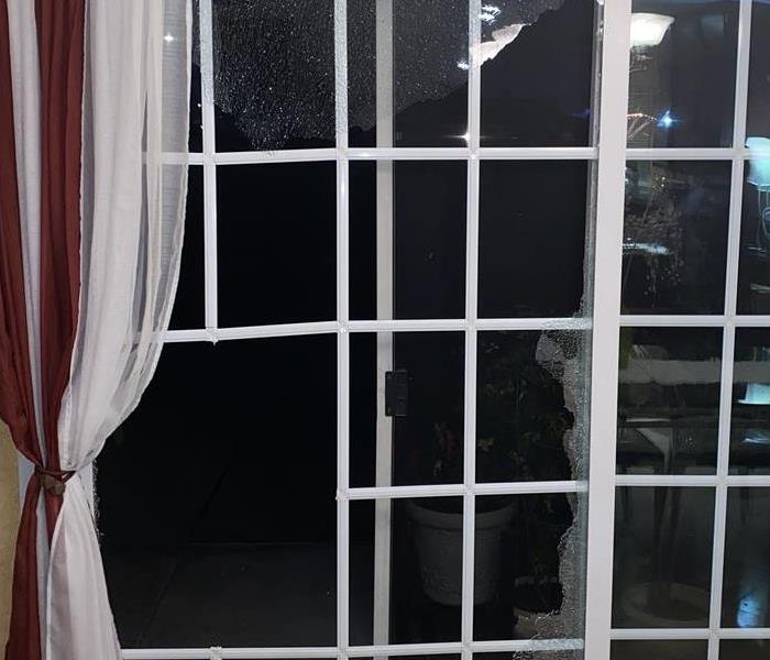 Broken glass door in home (Westminster community area) 