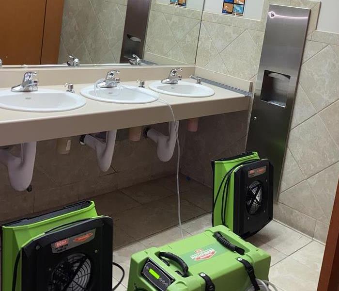 Green specialized equipment is placed in bathroom 