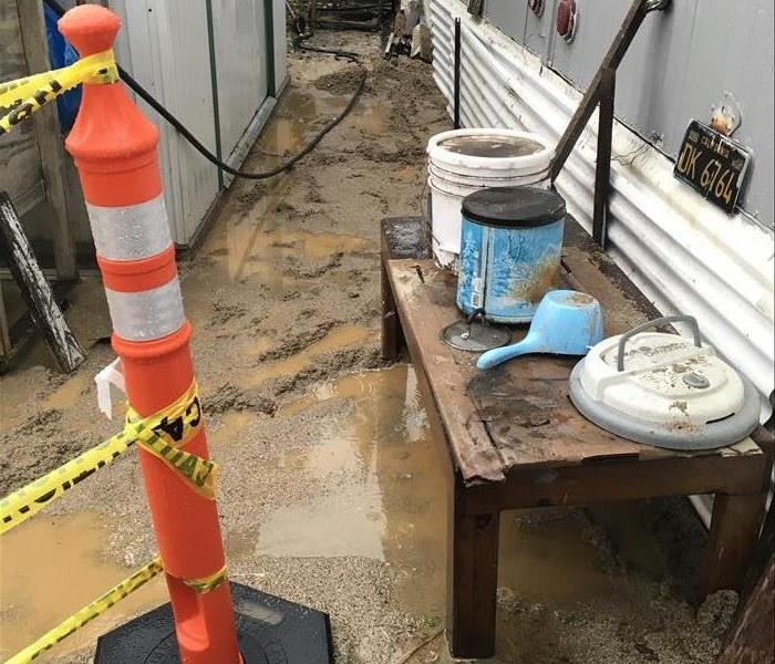 A sewage backup began to contaminate the outside of this Westminster home, but it then worsened because of the rainy season. 